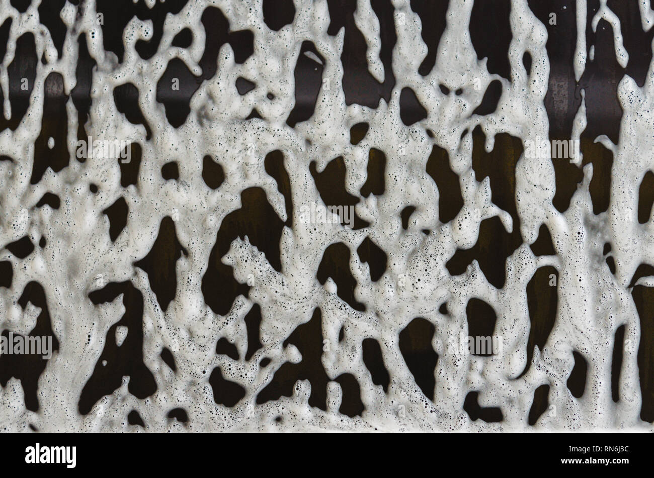 foam and soap on black background. Stock Photo