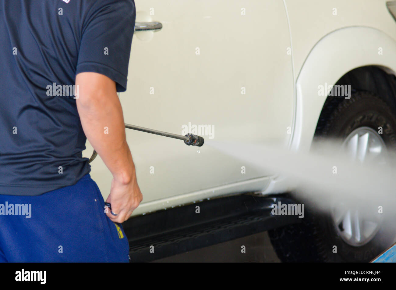 Cleaning Car Using High Pressure Water. Stock Photo