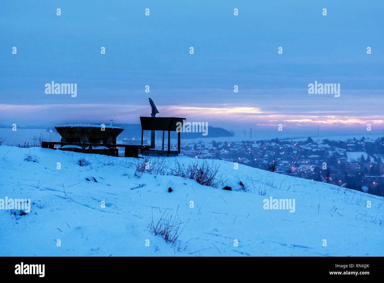 Sightseeing tourist telescope in Calvary, Nitra, Slovak republic. Travel destination. Night winter scene. Stock Photo