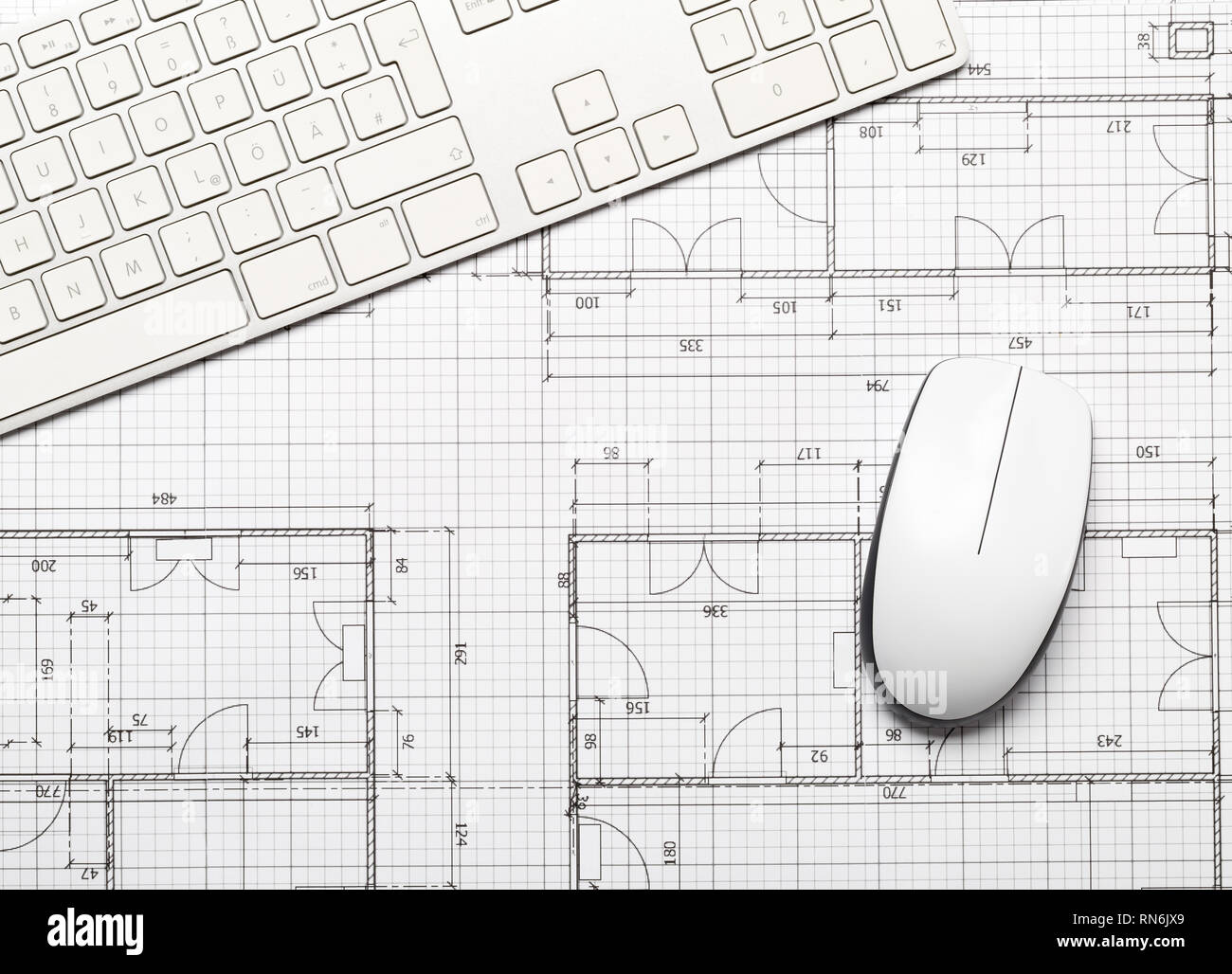 Architectural blueprint house building plan with computer keyboard and