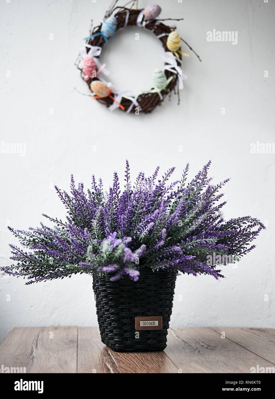 Happy Easter. Congratulatory easter background. Easter eggs and flowers. Stock Photo