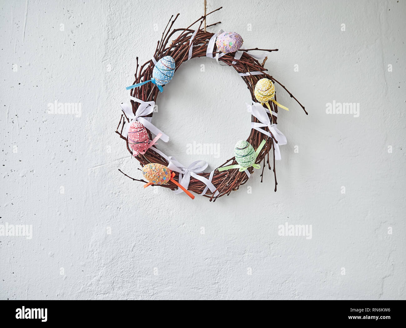 Happy Easter. Congratulatory easter background. Easter eggs and flowers. Stock Photo