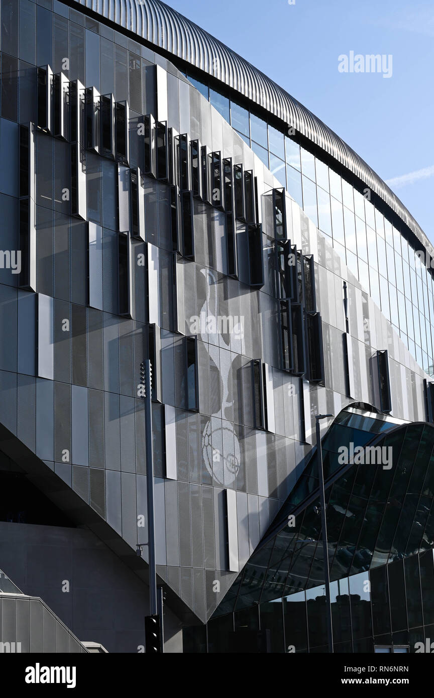 Tottenham London UK 17th February 2019 -  The new Tottenham Hotspur Stadium towers above the surrounding buildings in Tottenham High Road Stock Photo