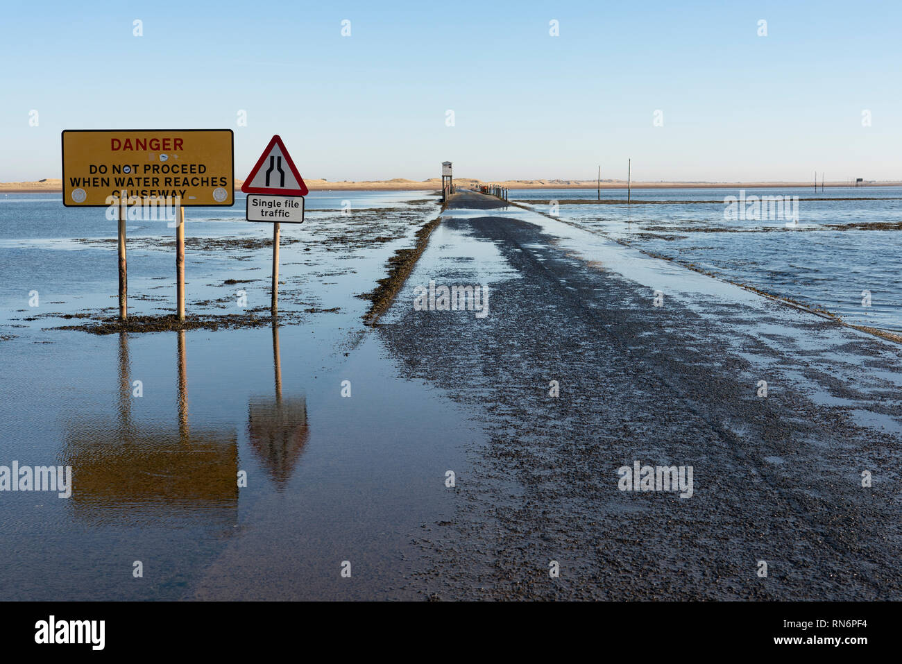 Tidal causeway road to Holy Island and Lindisfarne in  Northumberland , England, UK Stock Photo