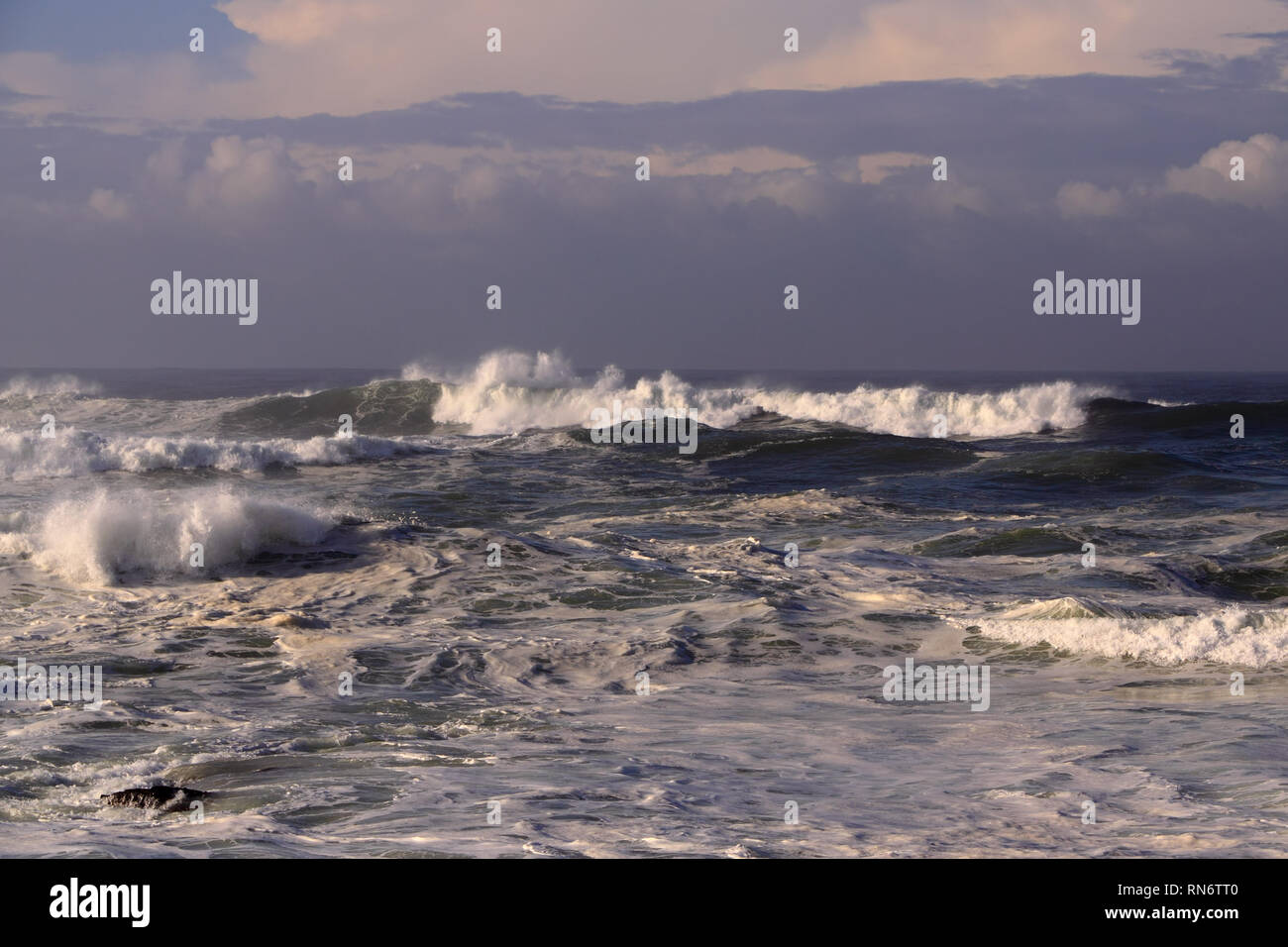 Stormy evening in the north Portuguese coast seeing clouds an waves Stock Photo