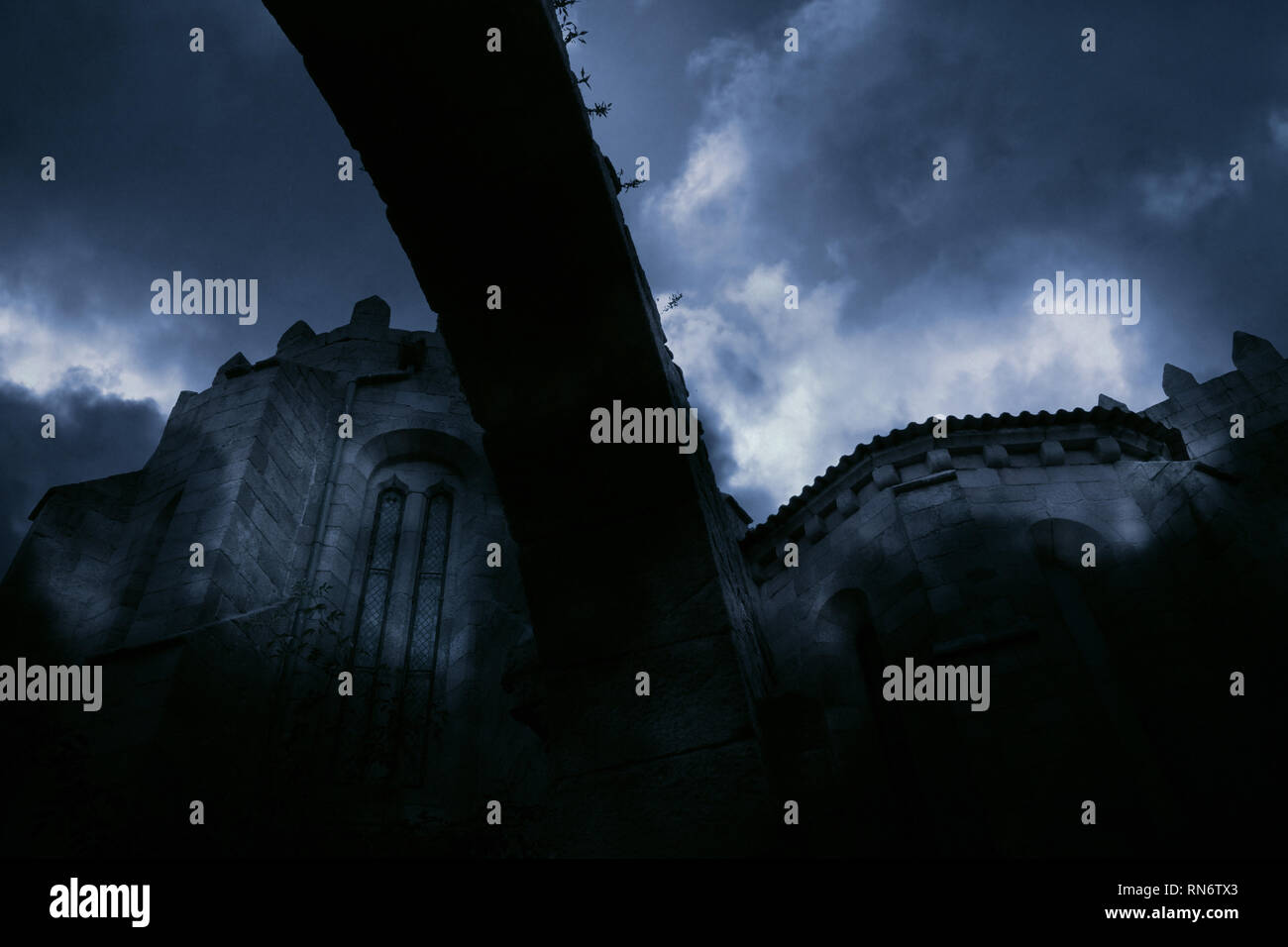 Medieval european abbey in a cloudy night Stock Photo