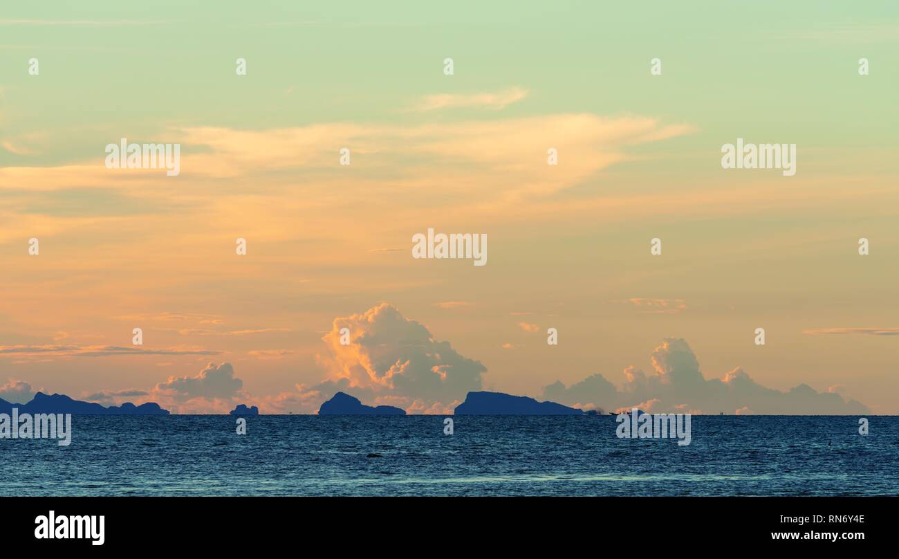Seascape bright blue sea skay white clouds background at dusk Stock Photo