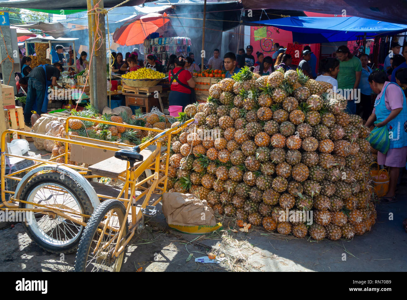 Piles of pineapples at a traditional Tlacolula market, Oaxaca, mexico Stock Photo