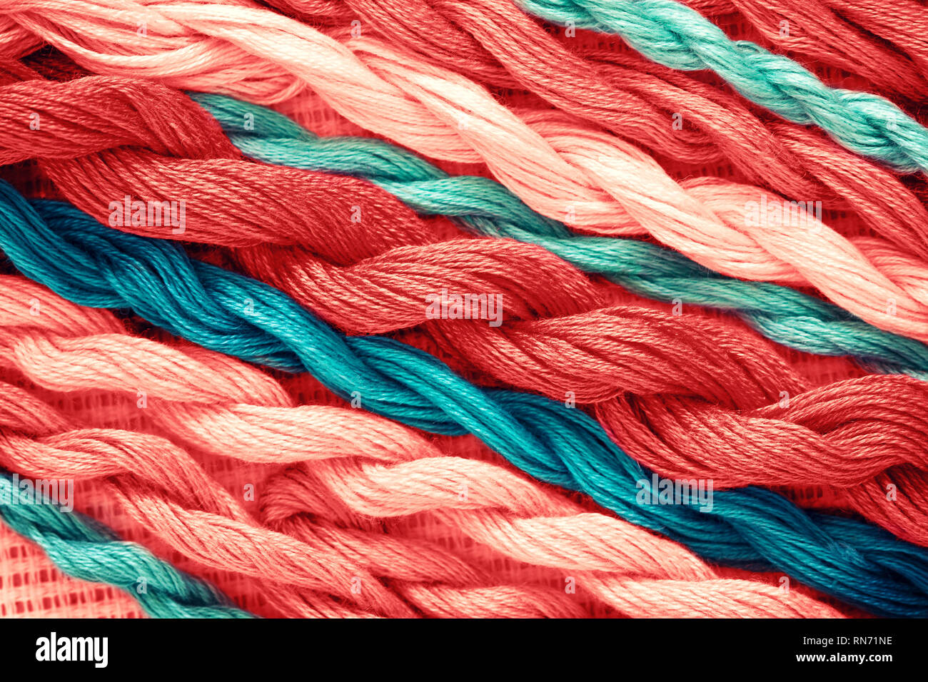 background threads for embroidery closeup. toning in the color of living coral Stock Photo