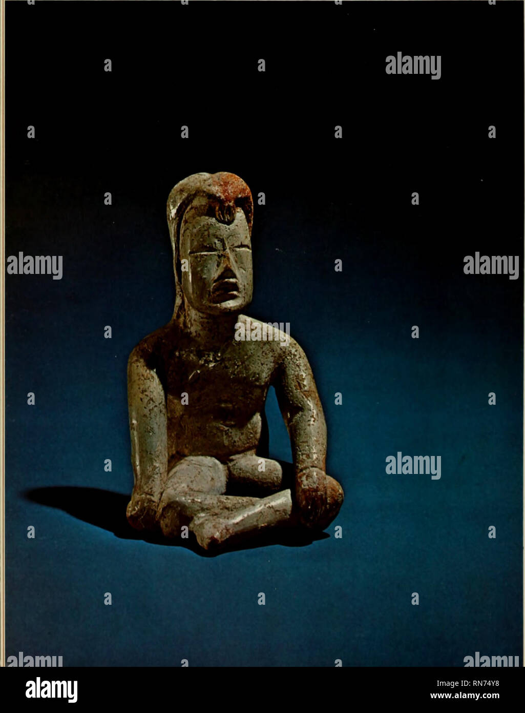 . Ancient Mexico and Central America. Indian art; Indian art. Perhaps the finest clay figurines yet found in Central Mexico come from the Pre-Classic site of Las Bocas in Puebla. Most have the simplified, strong faces, profiles and striking hairdos exemplified by this seated man; their eyes com- monly show no pupils, and all are nearly sexless. The white slip, the infantile- jaguar features, the form and posture, clearly mark the influence of the Olmecs in Central Mexico. The hair of this figure is painted with a red pigment, perhaps a depiction of an actual custom. The crimped drop at the poi Stock Photo