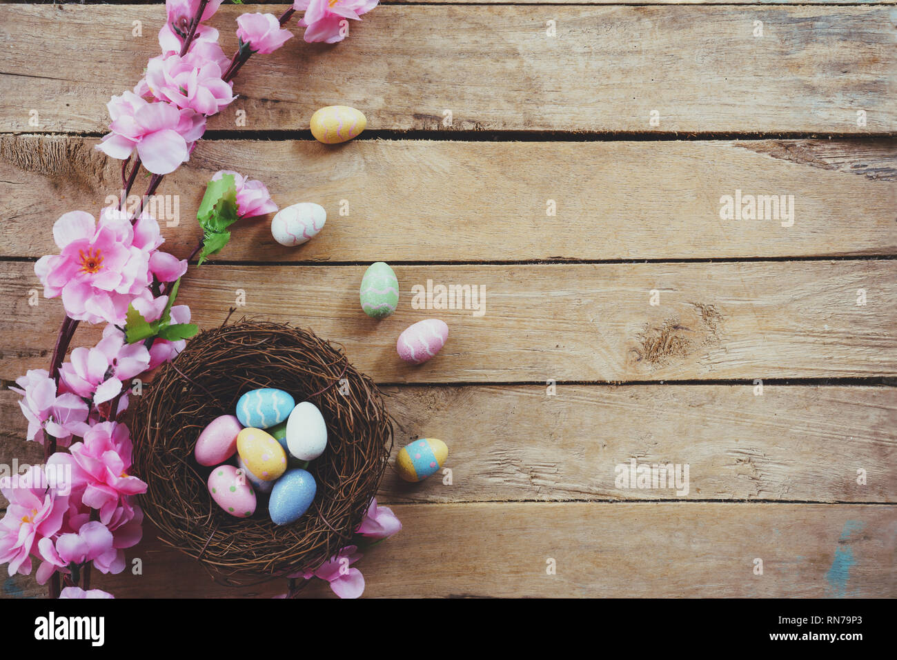 Cherry blossom Artificial flowers and easter egg in nest on vintage ...