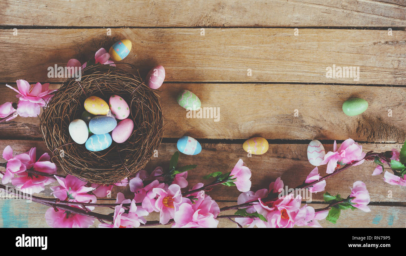 Cherry blossom Artificial flowers and easter egg in nest on vintage ...