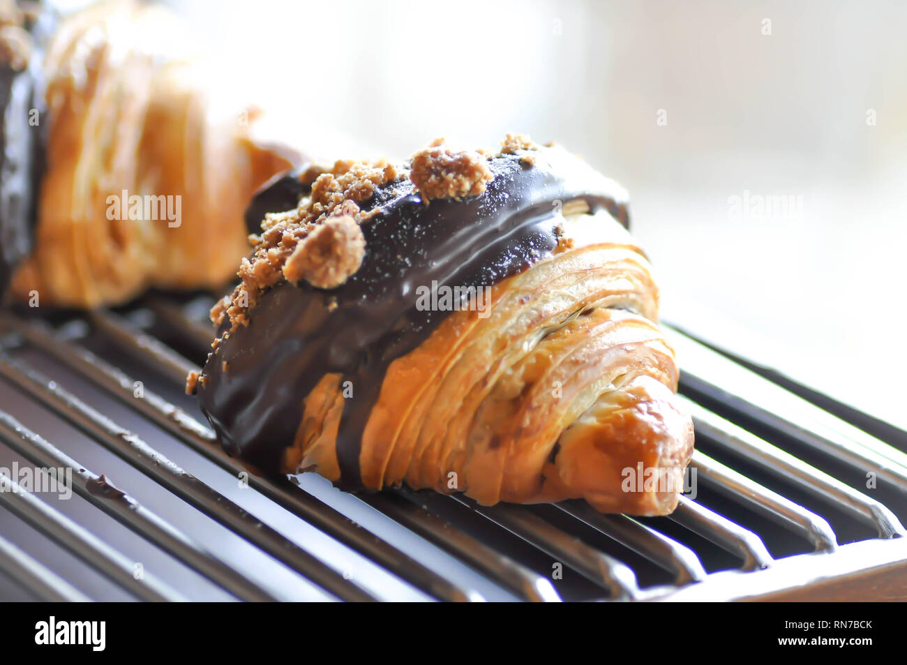 croissant pastry or chocolate croissant with cane sugar topping Stock Photo Alamy