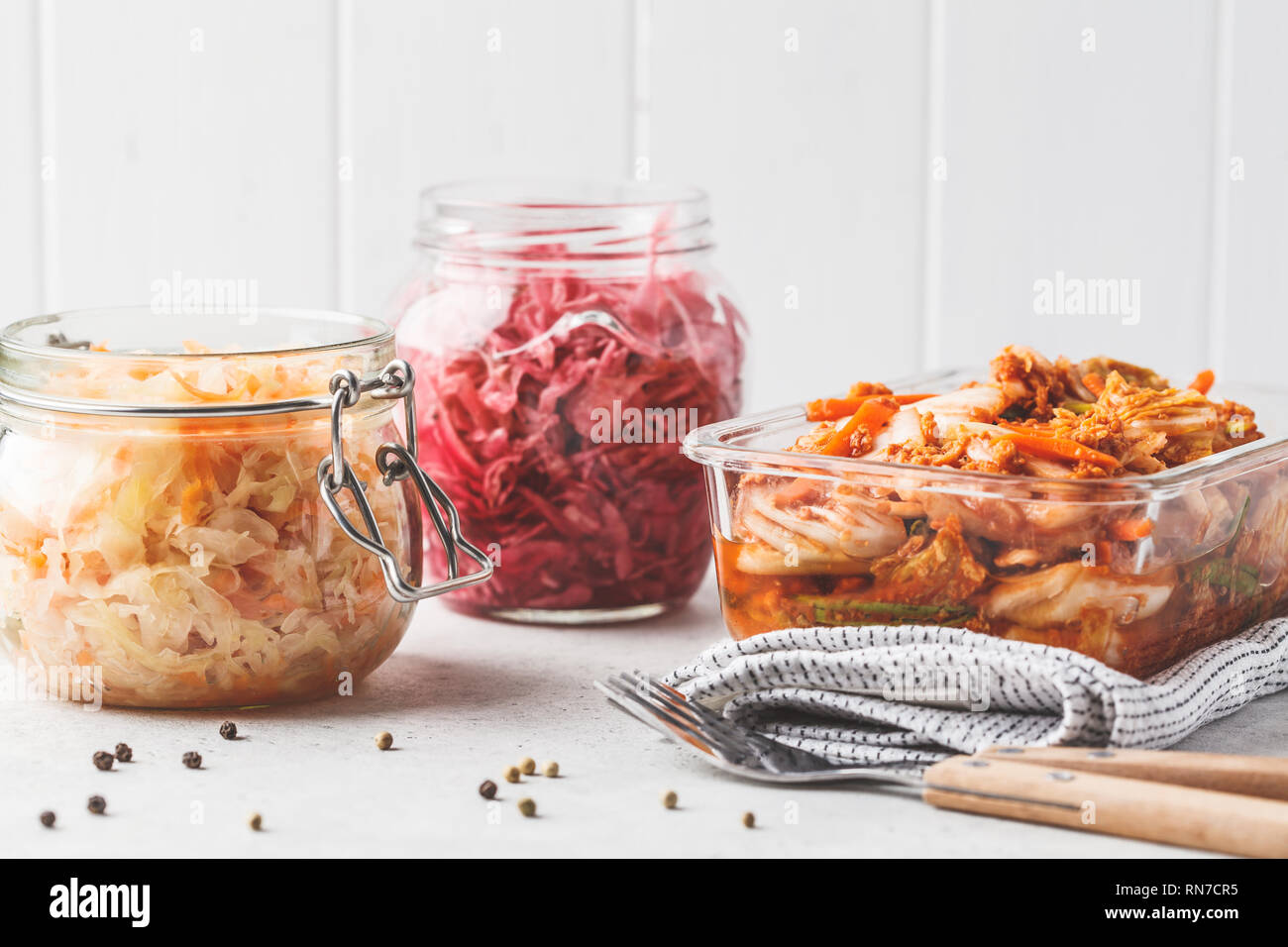 Korean kimchi cabbage, beet sauerkraut and sauerkraut in glass jars