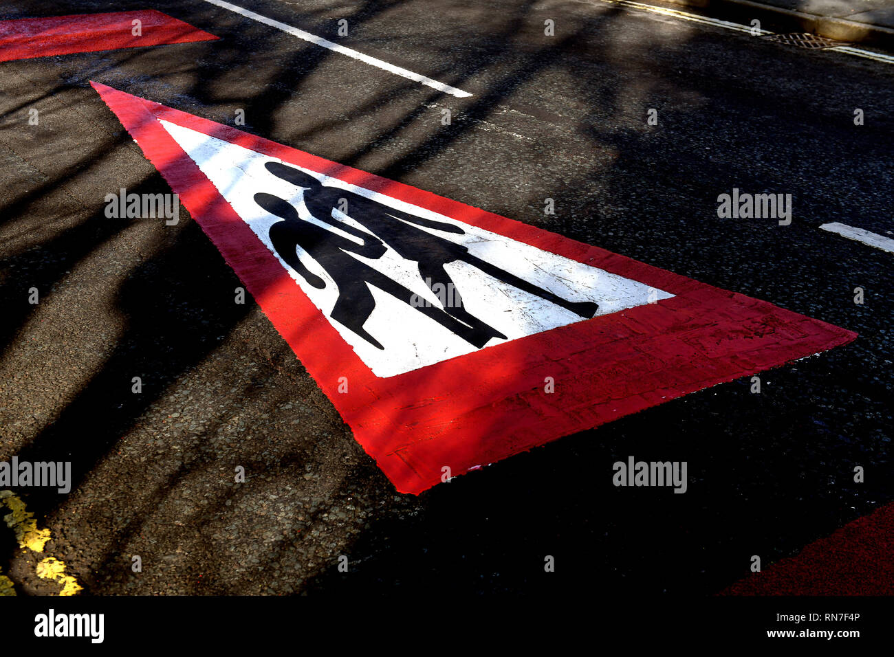 School zone childrens road safety marking sign for motorists Stock Photo