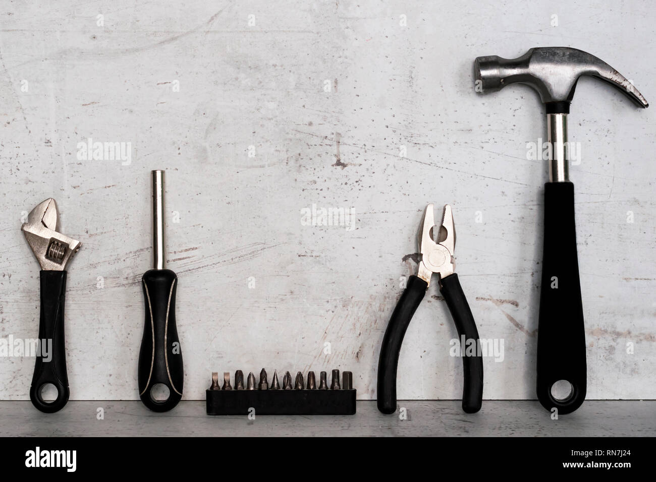 Construction tools are located on a light concrete background Stock Photo
