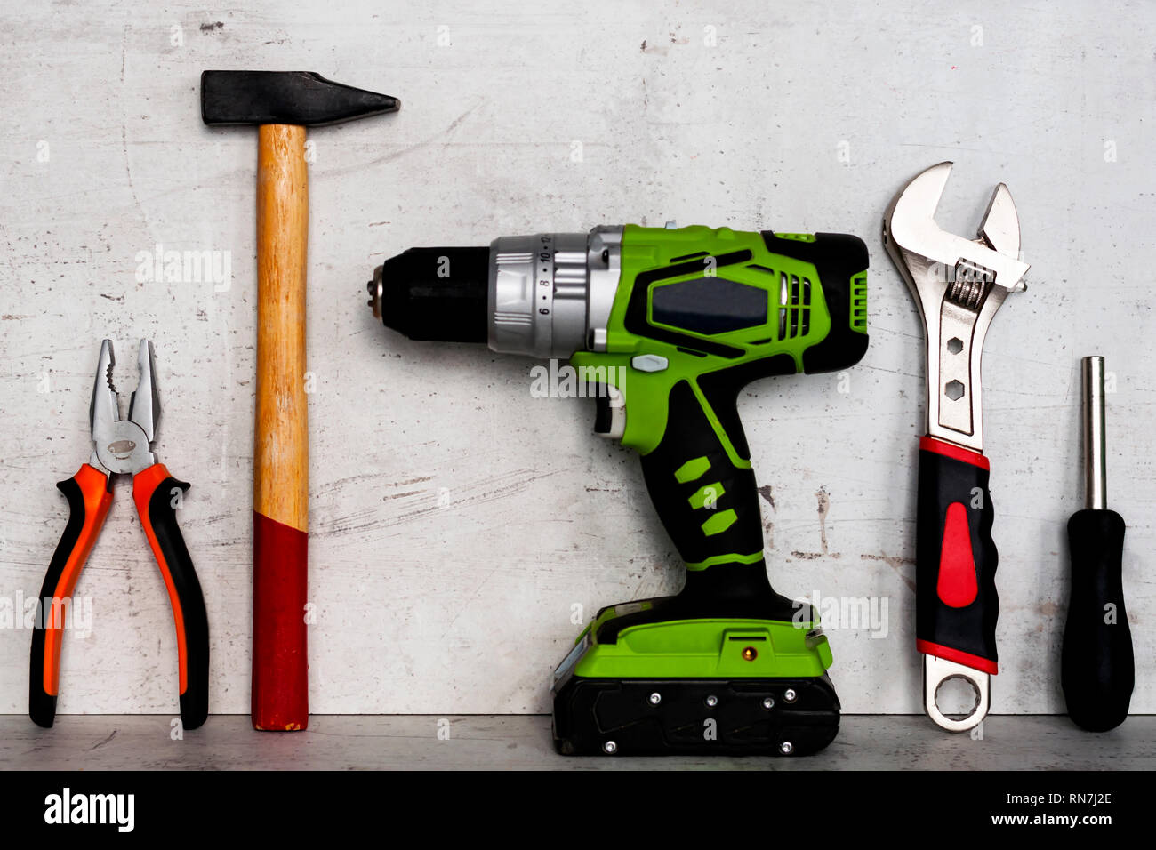 Construction tools are located on a light concrete background Stock Photo