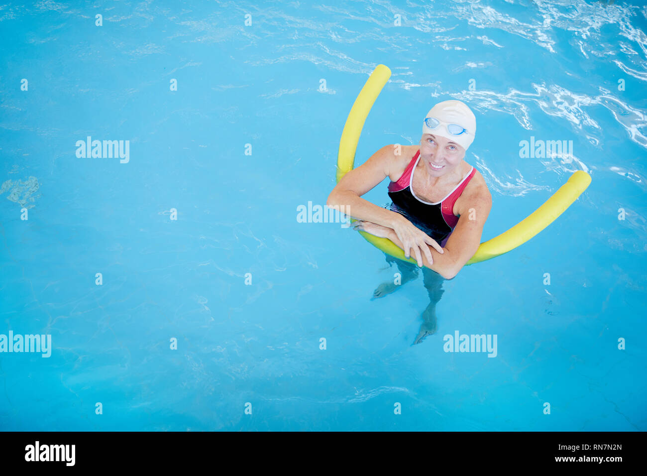 Pool woman swimming noodle water hi-res stock photography and images ...
