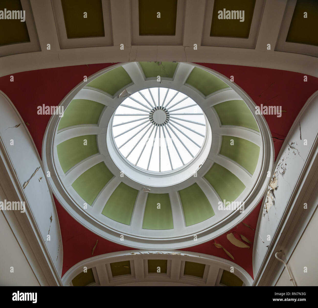 Glass dome cupola ceiling with flaking paint in need of refurbishment