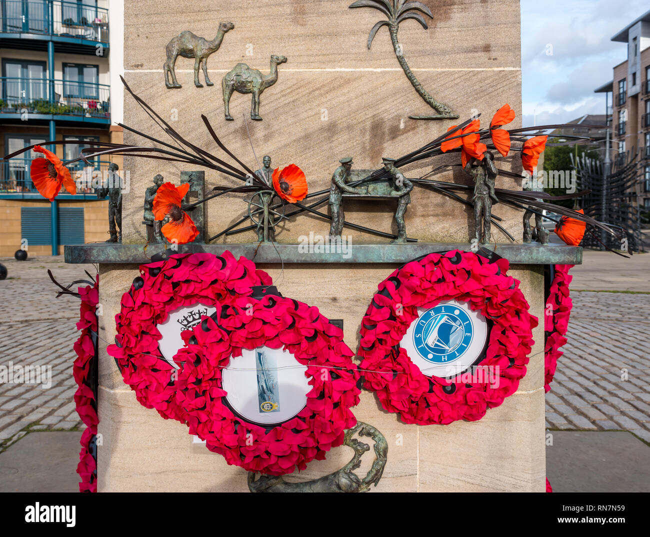 Merchant seamen memorial withpoppy wreaths by sculptor Jill Watson