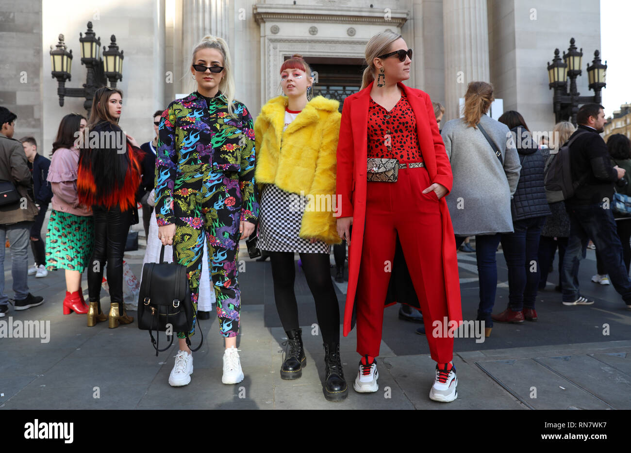 (left to right) Fashion bloggers Angell Turner wearing Jade LDN, Mia Kitty Donovan wearing Else and Fred and Spill the Tea London, and Natalie Turner wearing Topshop and Peacocks during the Autumn/Winter 2019 London Fashion Week outside Freemasons' Hall, London. Stock Photo