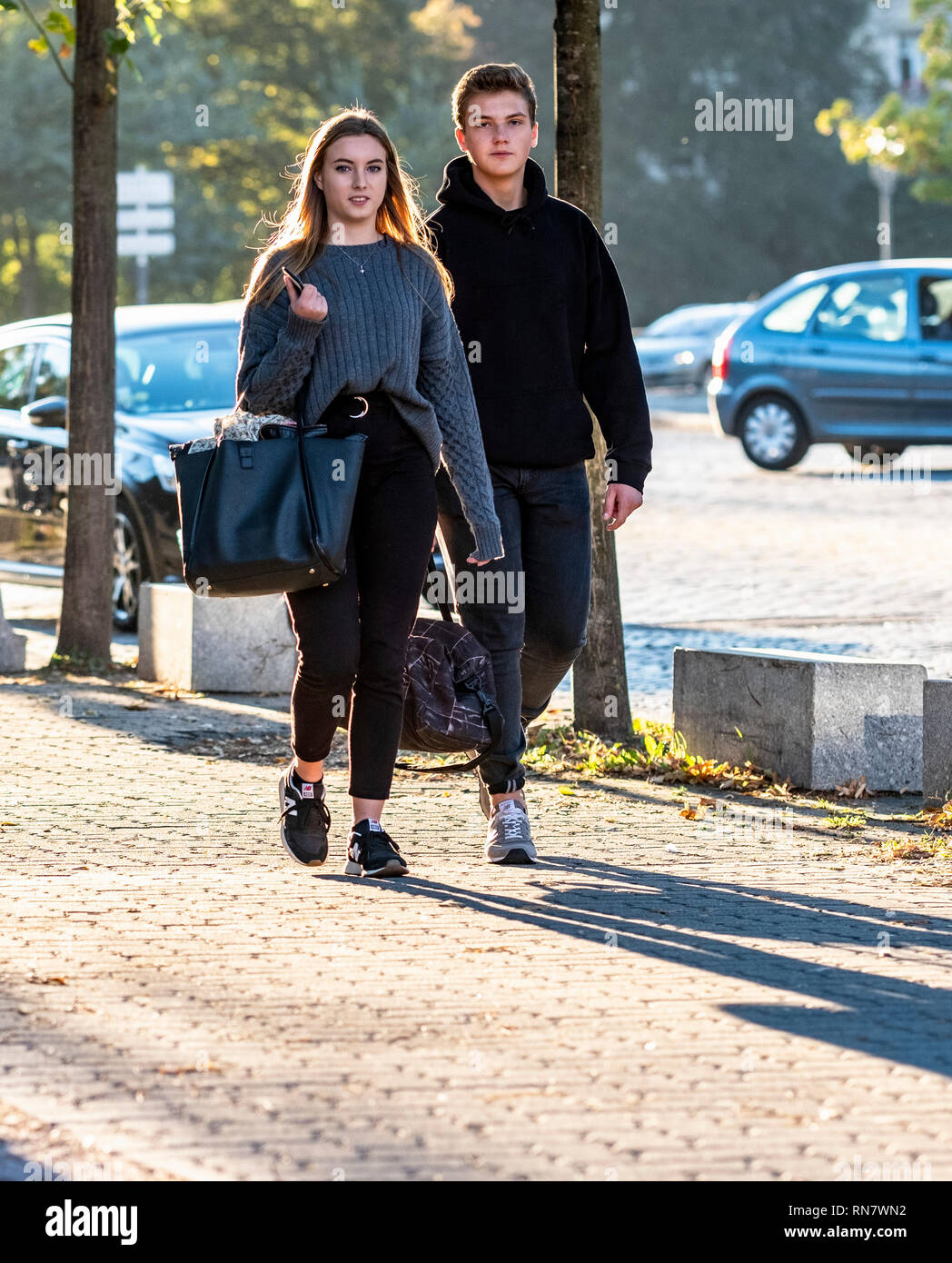 Strasbourg, Alsace, France, young couple walking on pavement, Stock Photo