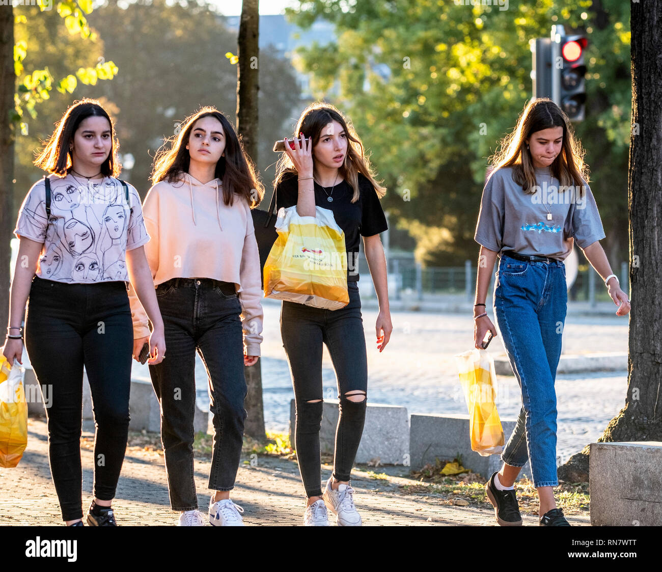 Strasbourg, Alsace, France, Europe, group of 4 teenage girls walking on pavement, Stock Photo