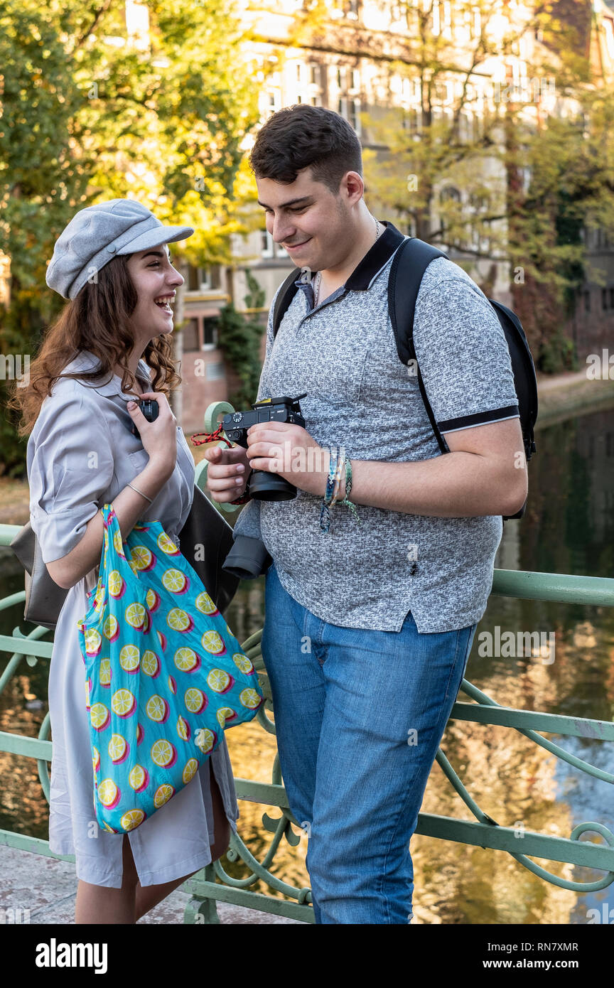Strasbourg, Alsace, France, young couple of tourists having fun with pictures at their digital camera, Stock Photo