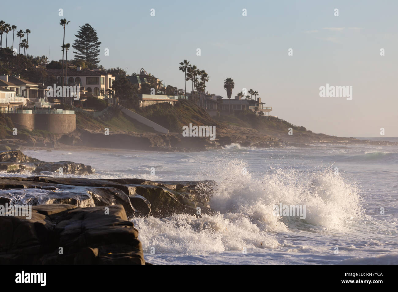 Waves Break At Rocks On The Windansea Beach With A View At Beach Houses In The Background In La Jolla San Diego California Stock Photo Alamy