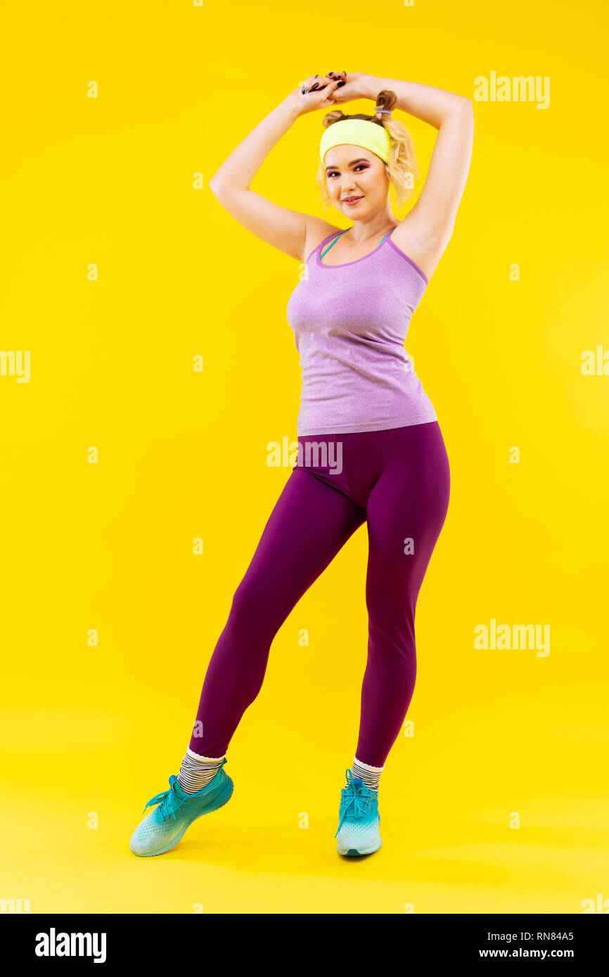 Appealing young woman in a good shape wearing sport clothes Stock Photo ...