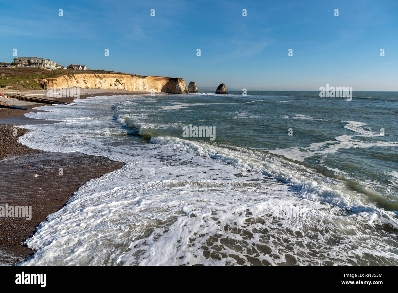 Freshwater Bay, Isle of Wight, England, UK. February 2019. Incoming tide on a winters afternoon on the Isle of Wight Stock Photo
