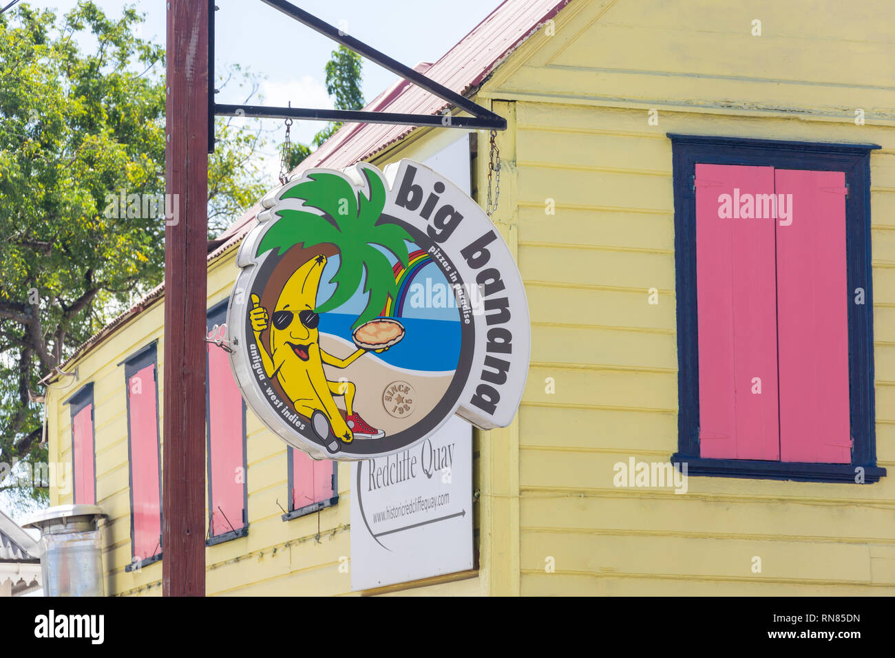 'Big Banana' pizza sign in historic Redcliffe Quay, St John's, Antigua, Antigua and Barbuda, Lesser Antilles, Caribbean Stock Photo