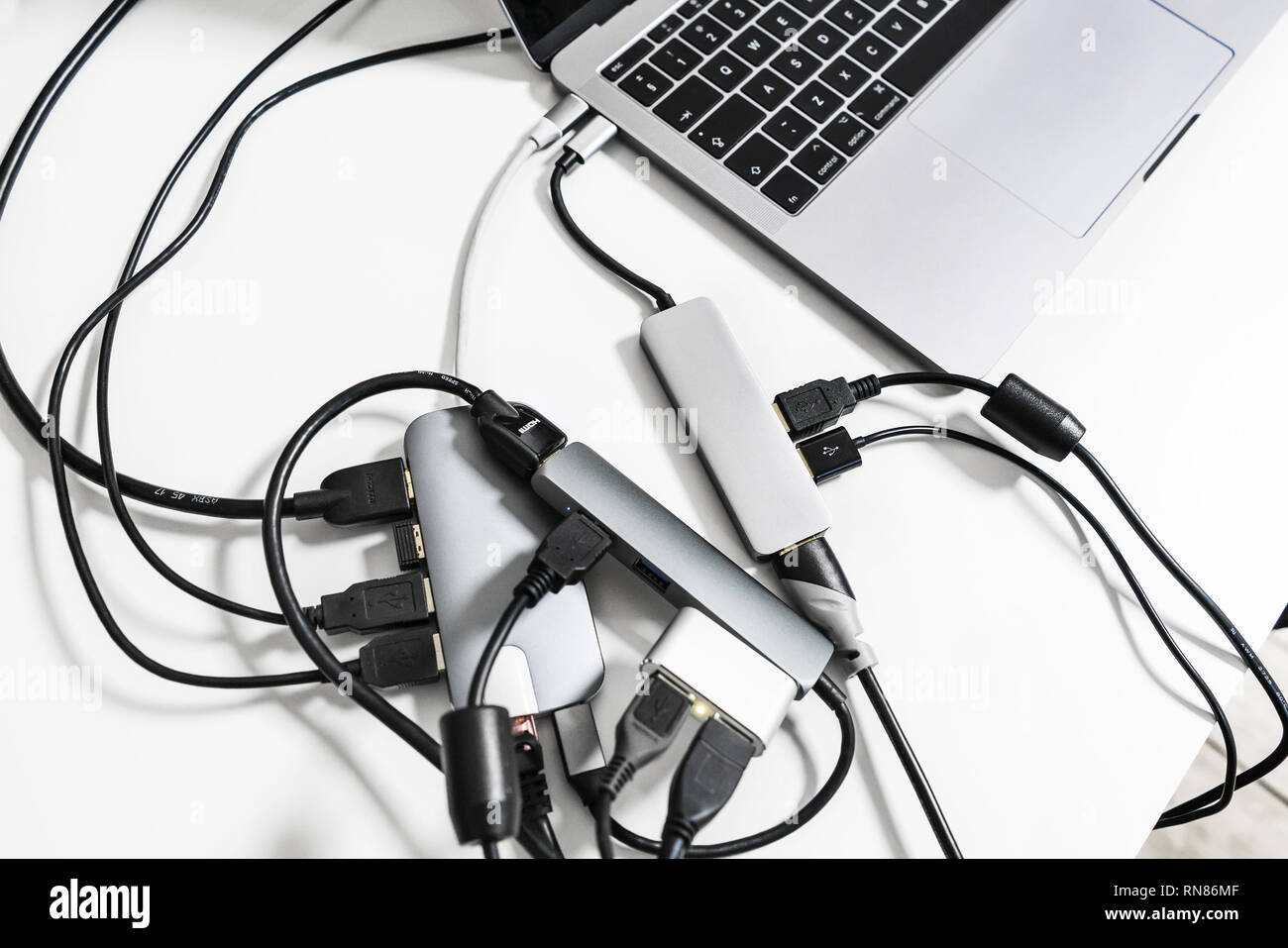 Laptop with adapters, disorder Stock Photo