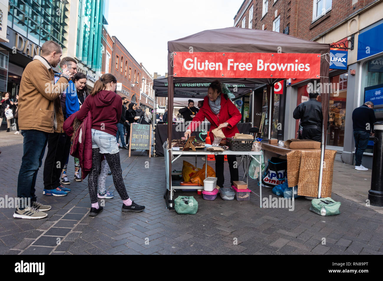 A stall selling gluten free brownies at a street market in Peascod Street in Windsor, Berkshire, UK Stock Photo