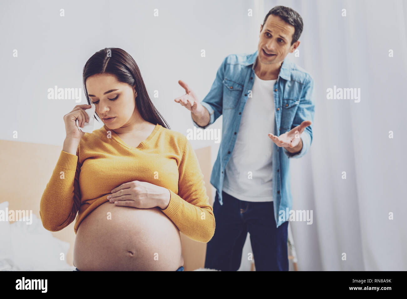 I Am Sorry Anxious Man Wrinkling Forehead While Talking To His Wife Stock Photo Alamy I Am Sorry Anxious Man Wrinkling Forehead While Talking To His Wife Stock Photo Alamy