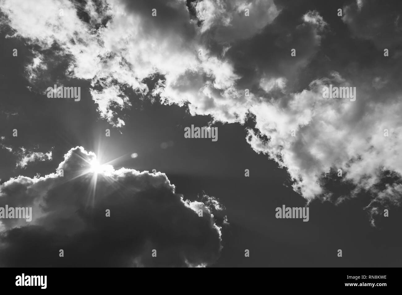 Sunlight through storm clouds Black and White Stock Photos & Images - Alamy