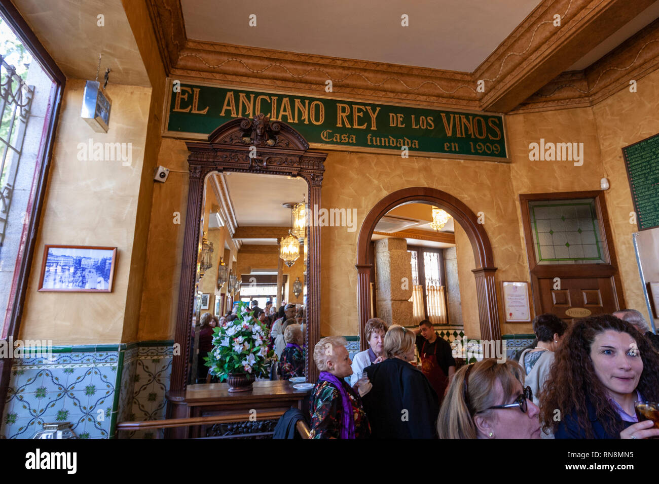 Costumers inside the El Anciano Rey de los Vinos, typical sweet wines bar in Calle de Bailén