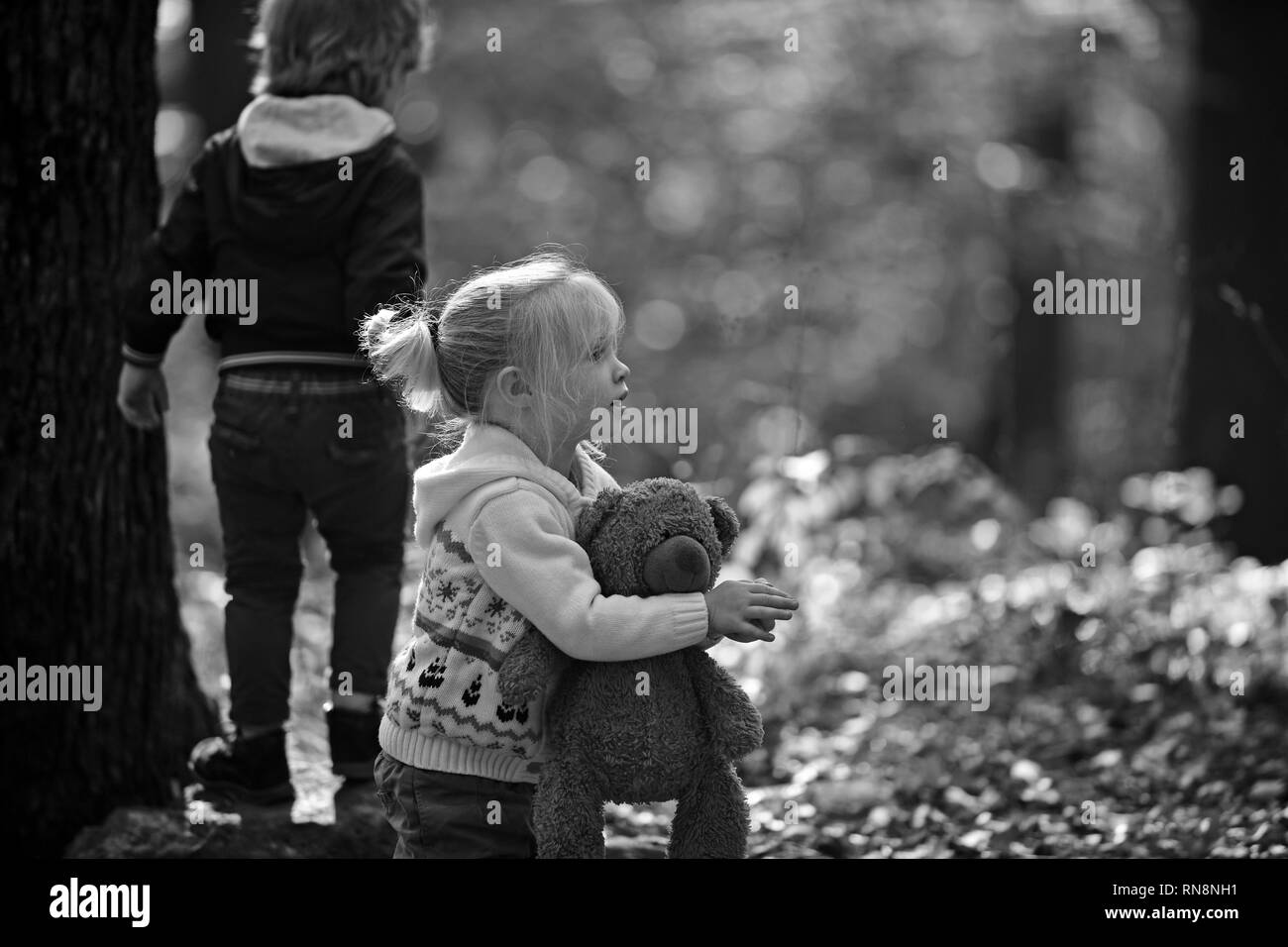 Sister and brother have fun on fresh air. Little boy and girl friends camping in woods. Childhood and child friendship, love and trust. Kids activity Stock Photo