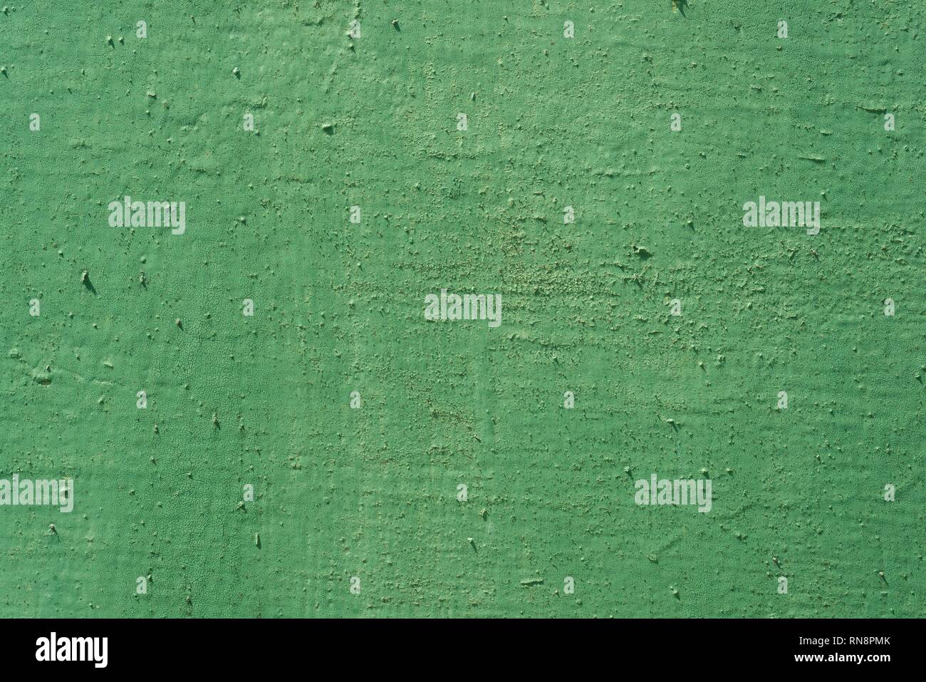 Texture background green painted cracked iron surface. Stock Photo