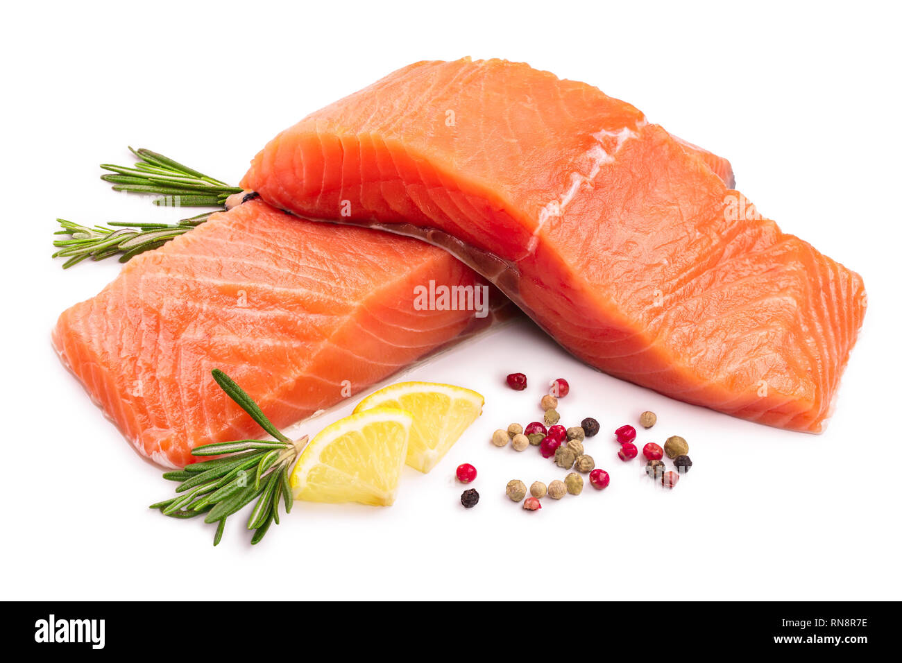 fillet of red fish salmon with lemon and rosemary isolated on white background Stock Photo