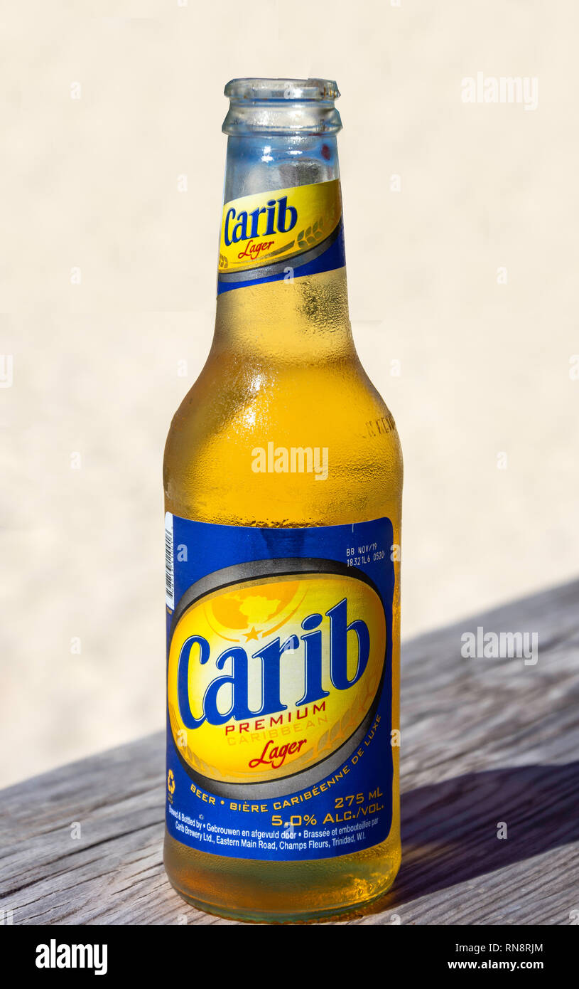 Bottle of local Carib premium lager, Dickenson Bay Beach, Antigua, Antigua and Barbuda, Lesser Antilles, Caribbean Stock Photo