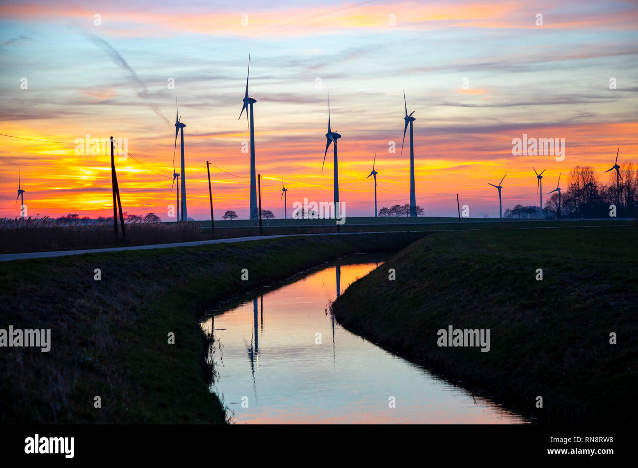 Utgast wind farm, wind park, in the district of Wittmund, East Frida, Lower Saxony, Germany, sunset, Stock Photo