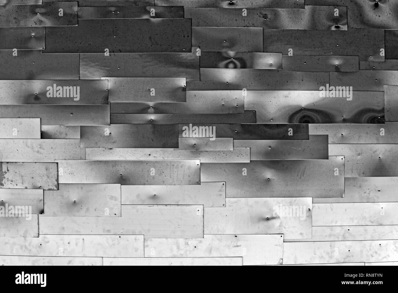 Grey wall made of aluminium sheets Stock Photo
