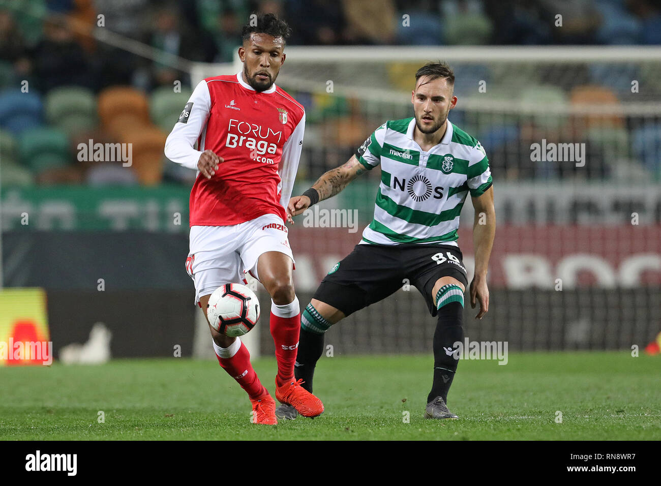 Dyego Sousa of SC Braga (L) vies for the ball with Nemanja Gudelj of Sporting CP (R) during the League NOS 2018/19 footballl match between Sporting CP vs SC Braga.  (Final score: Sporting CP 3 - 0 SC Braga) Stock Photo