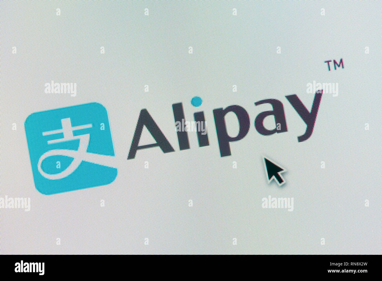 The logo of Alipay is seen on a computer screen along with a mouse cursor (Editorial use only) Stock Photo