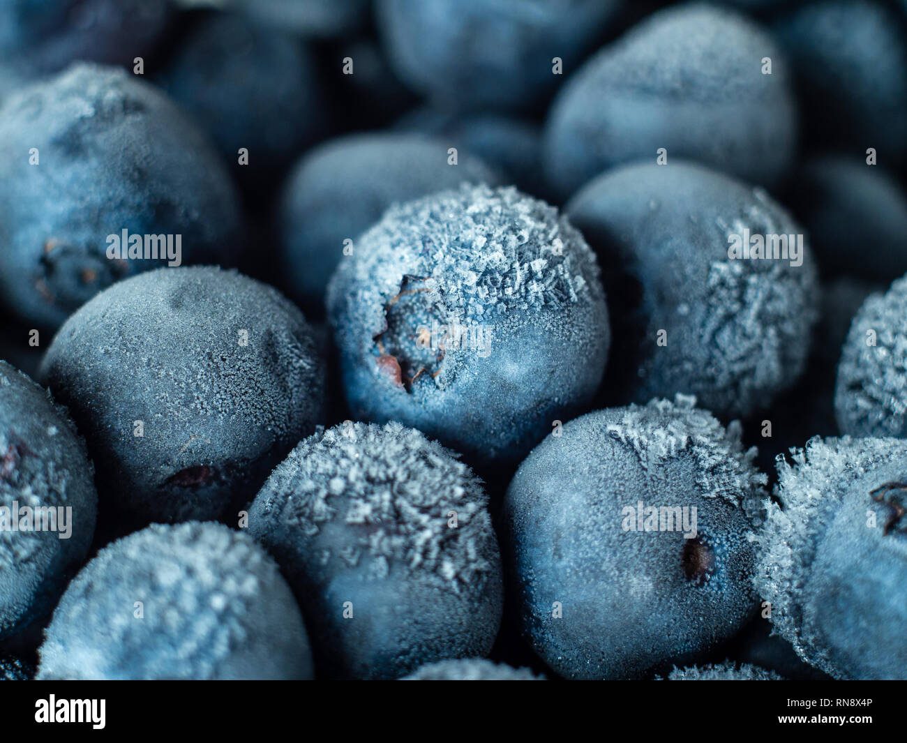 Healthy Breakfast: Close up of frozen blueberries, macro shot, top view Stock Photo
