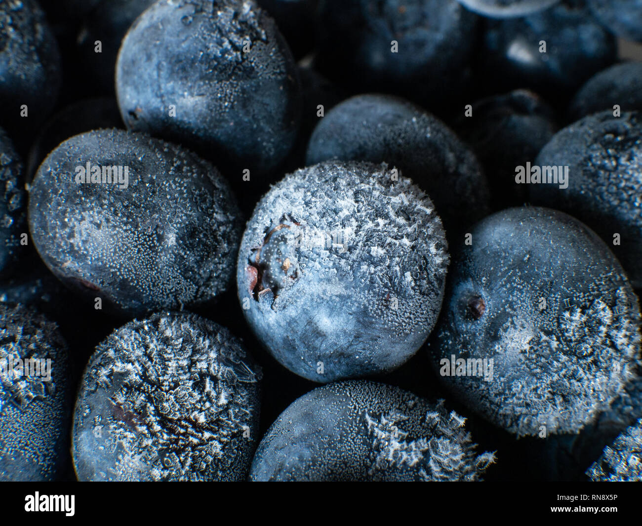 Healthy Breakfast: Close up of frozen blueberries, macro shot, top view Stock Photo
