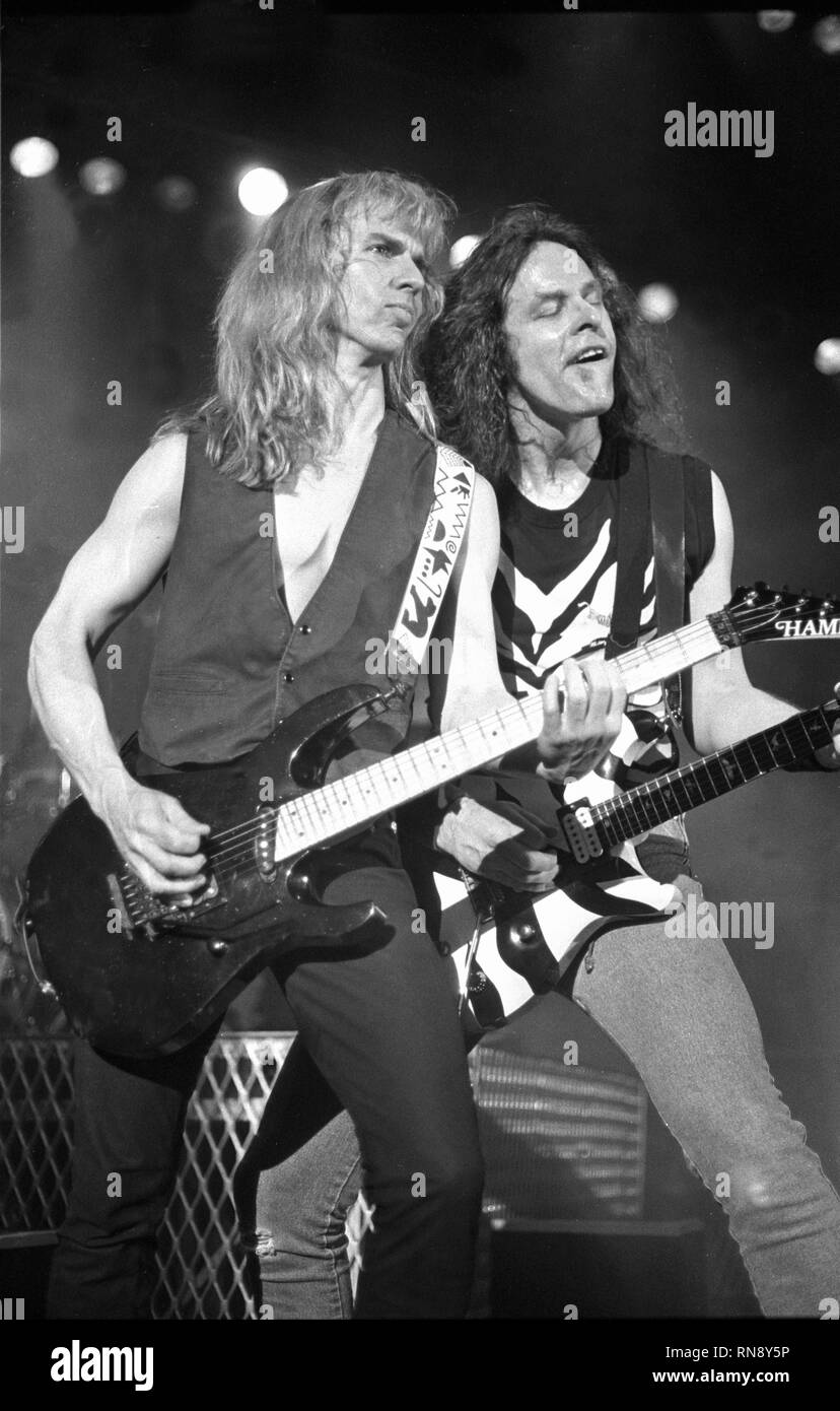 Damn Yankees musicians Ted Nugent and Tommy Shaw are shown performing on stage during a 'live' concert appearance. Stock Photo