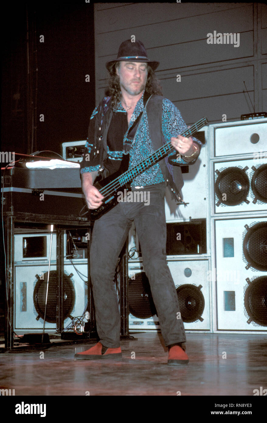 Deep Purple bassist Roger Glover is shown performing on stage during a 'live' concert appearance. Stock Photo