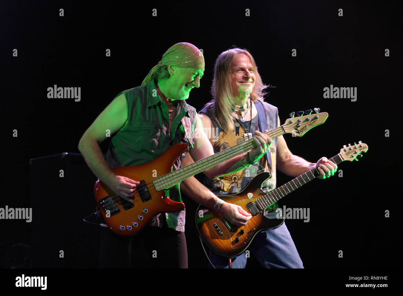 Deep Purple bassist Roger Glover and guitarist Steve Morse are shown performing together during a 'live' concert appearance. Stock Photo